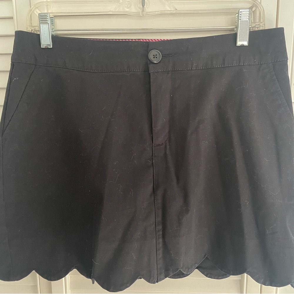Black skort with scalloped hemline